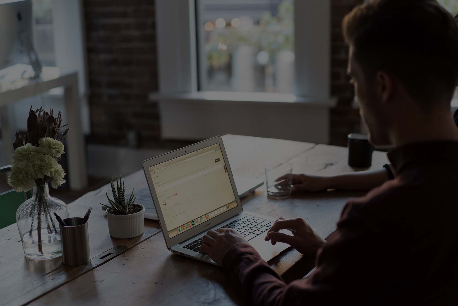 Remote worker coworking at desk in Denver