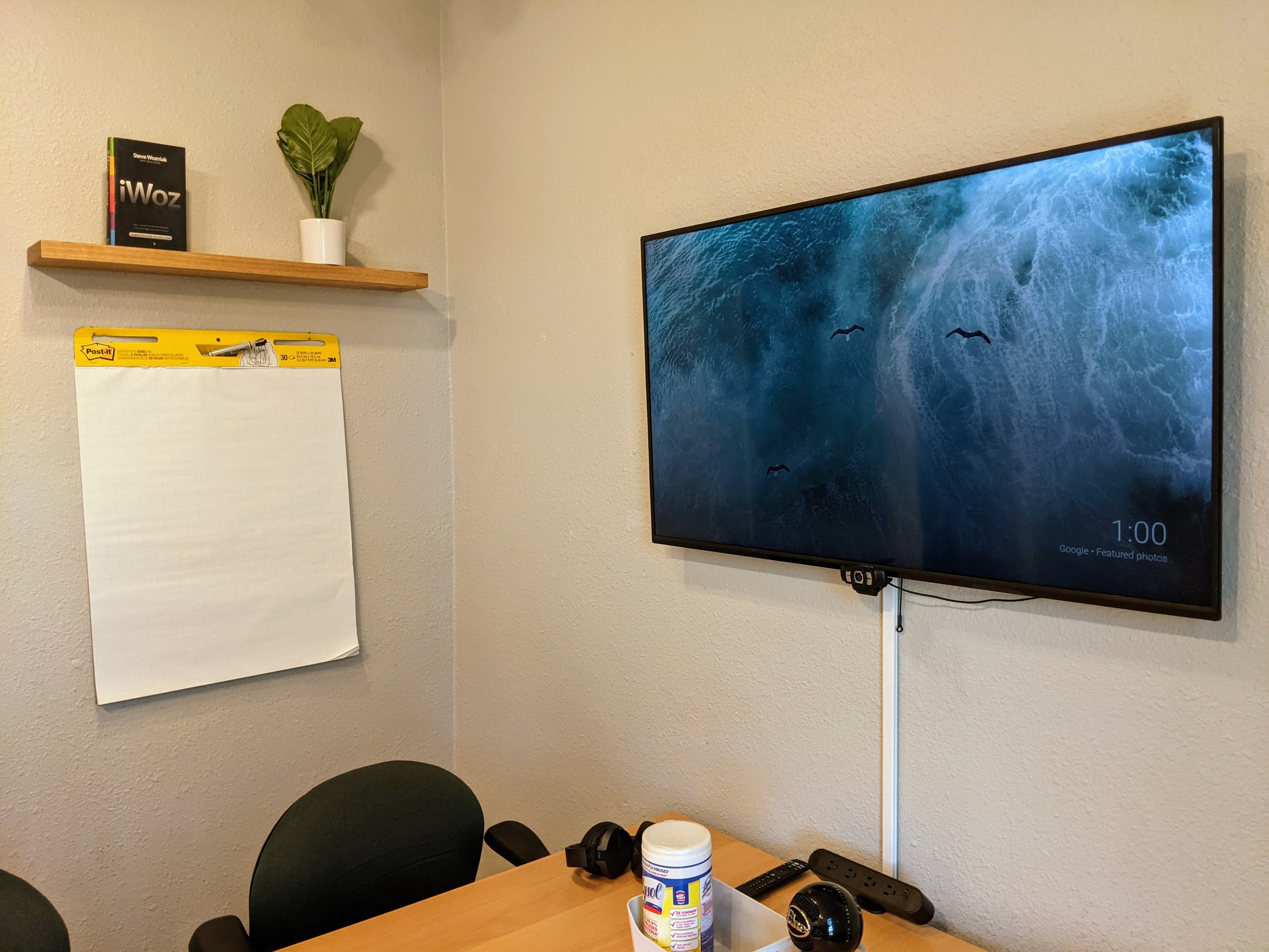 Conference room with TV and whiteboard in Denver