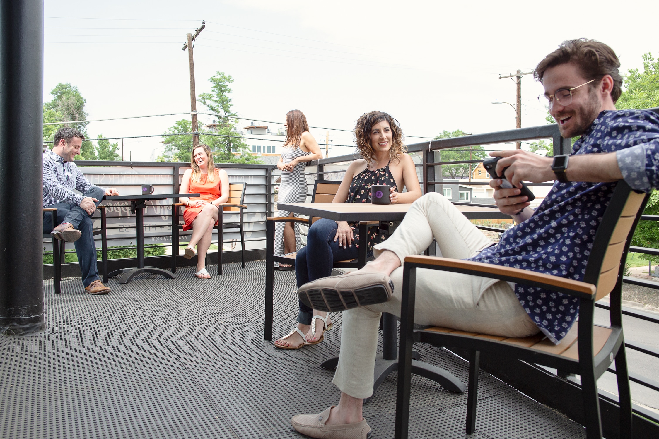 Members on the Balcony for coworking and office members in Sunnyside and Lohi