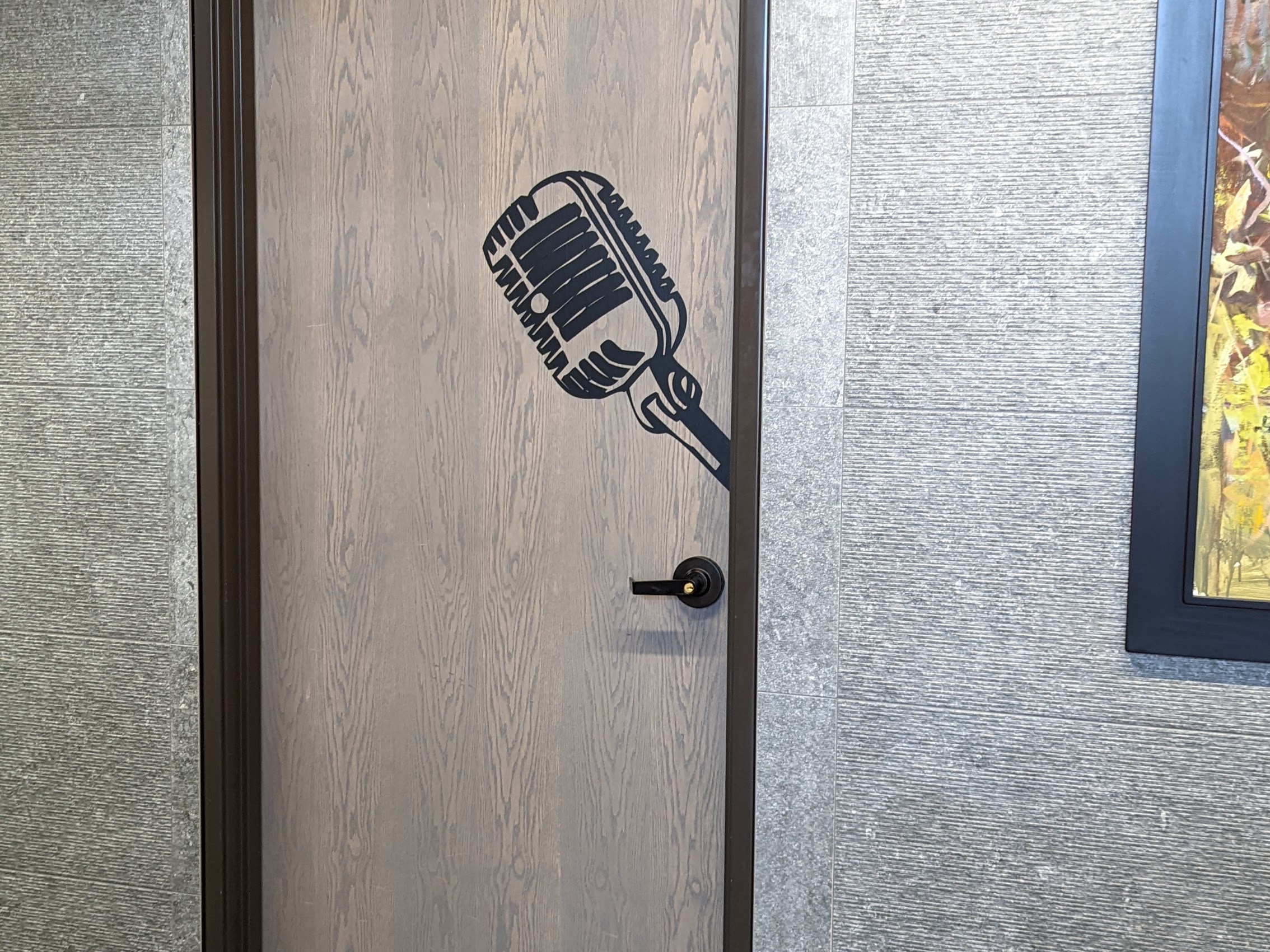 Podcasting Studio Door in Denver with a Microphone Decal